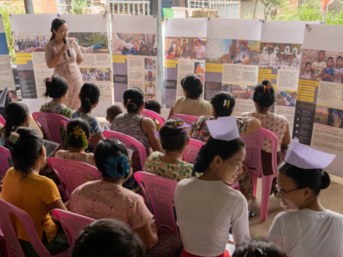 group of nurses listening and watching a presentation